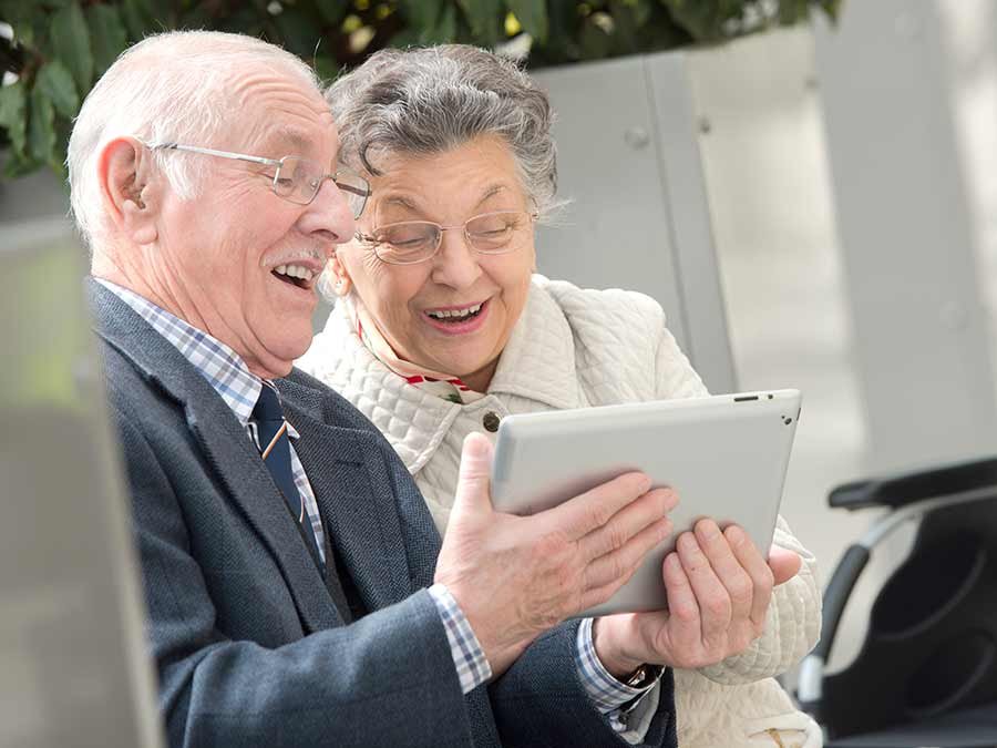 a couple researching the symptoms of hearing loss